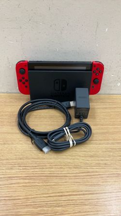 NINTENDO SWITCH RED JOY-CONS CHARGING DOCK AND HDMI CABLE.
