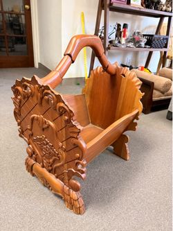 Carved mahogany magazine rack