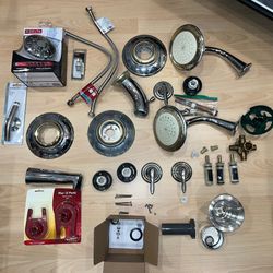 2 Used Moen Shower and 1 Used Moen Bathtub Assembly (all 3 Heavy Metal) - 1 Delta Shower Head (brand new) - Other Parts