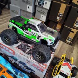 1/10 scale RC monster truck 4 wheel drive including remote control battery and a charger brushed electric
