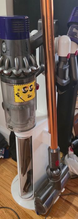 Dyson v10 with dock and accessories.