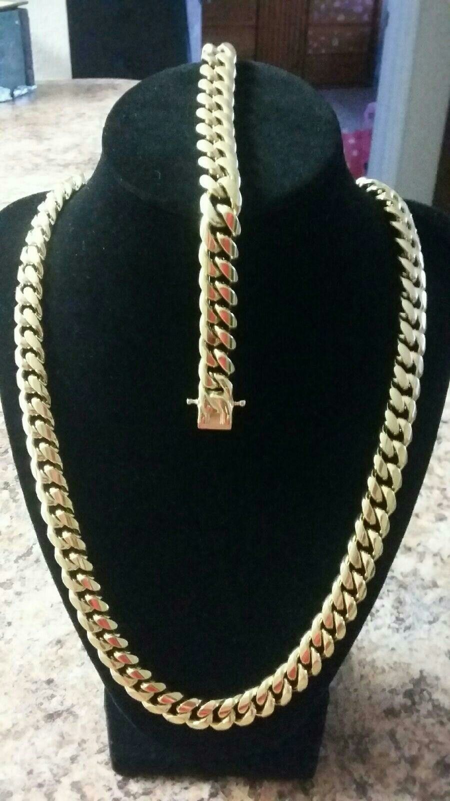 Very nice 14kt gold over staineless steel 12mm by 3oinch long Miami cuban link Chain with matching bracelet for sale !!