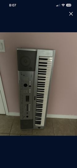 Piano This item is a Yamaha Portable Grand digital keyboard, likely the DGX-230 mode