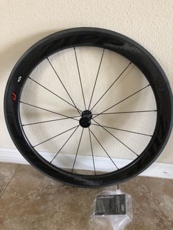 Zipp 404 firecrest front wheel tubular brand new in box comes with zipp brake pad , no skewer.