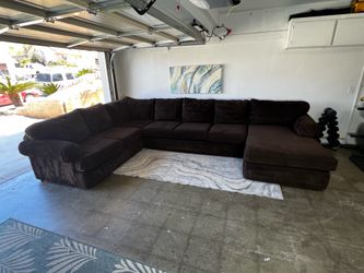 The brown sectional couch (Delivery available)