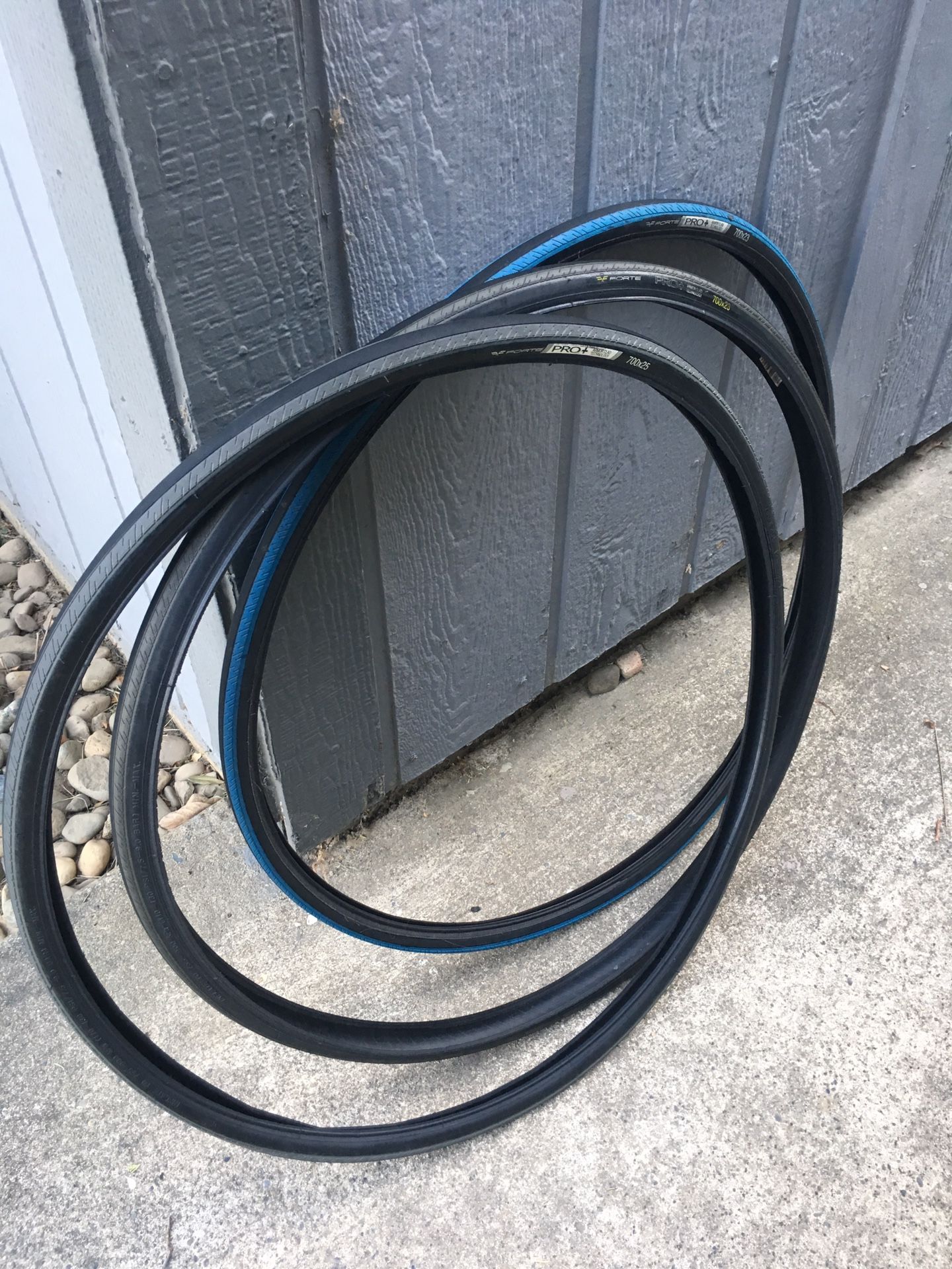Three road bike tires. Forte Pro+ racing tires. Selling for 5 each or
