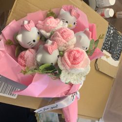 ramo de flores y hellow kitty para la graduacion 