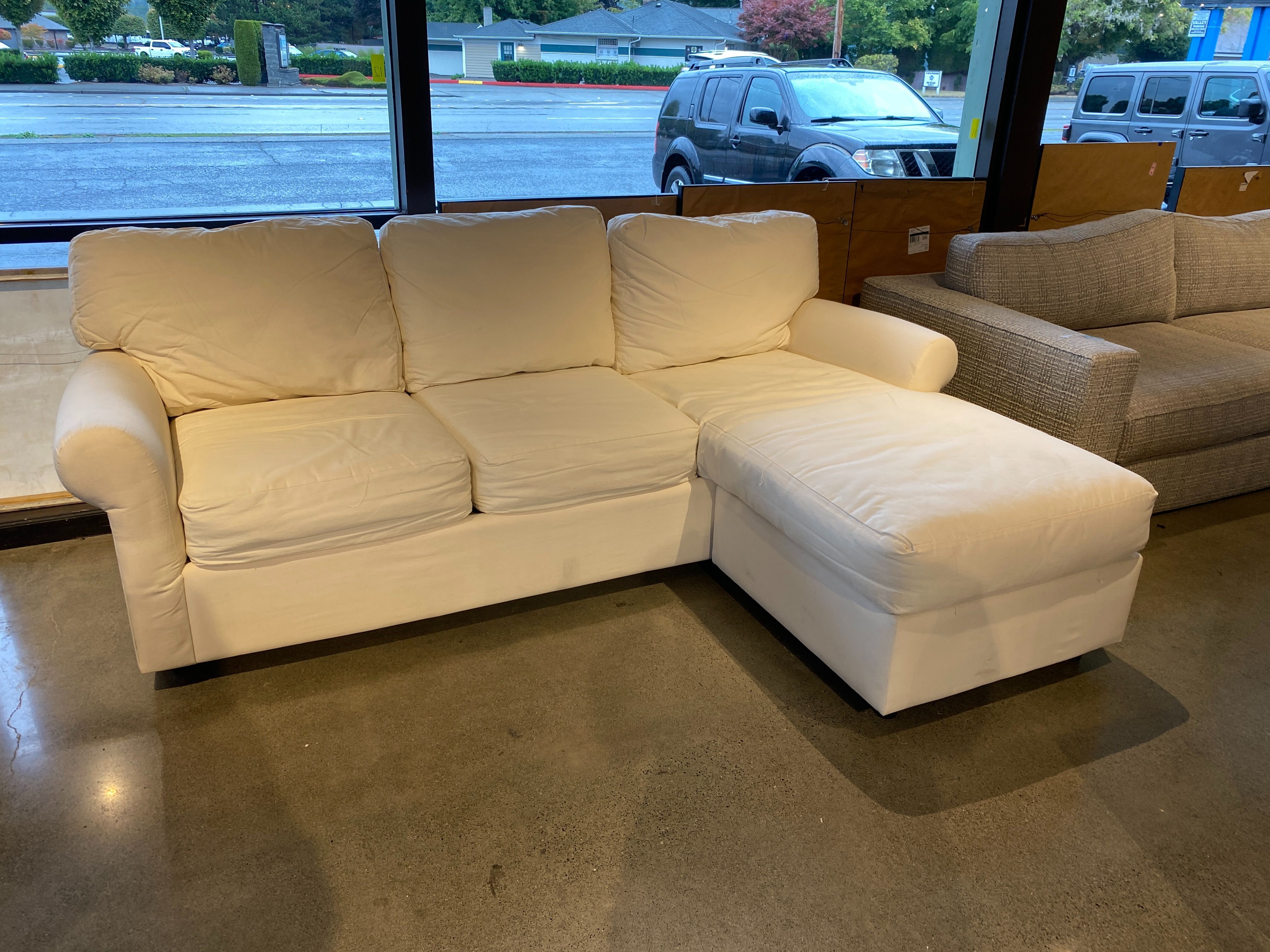 White Couch with Right Chaise and Rolled Arms