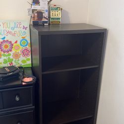 A Bundle With A Dresser, A Bookshelf, Movies Close The Picture The Heater, The Slot Machine, The Books