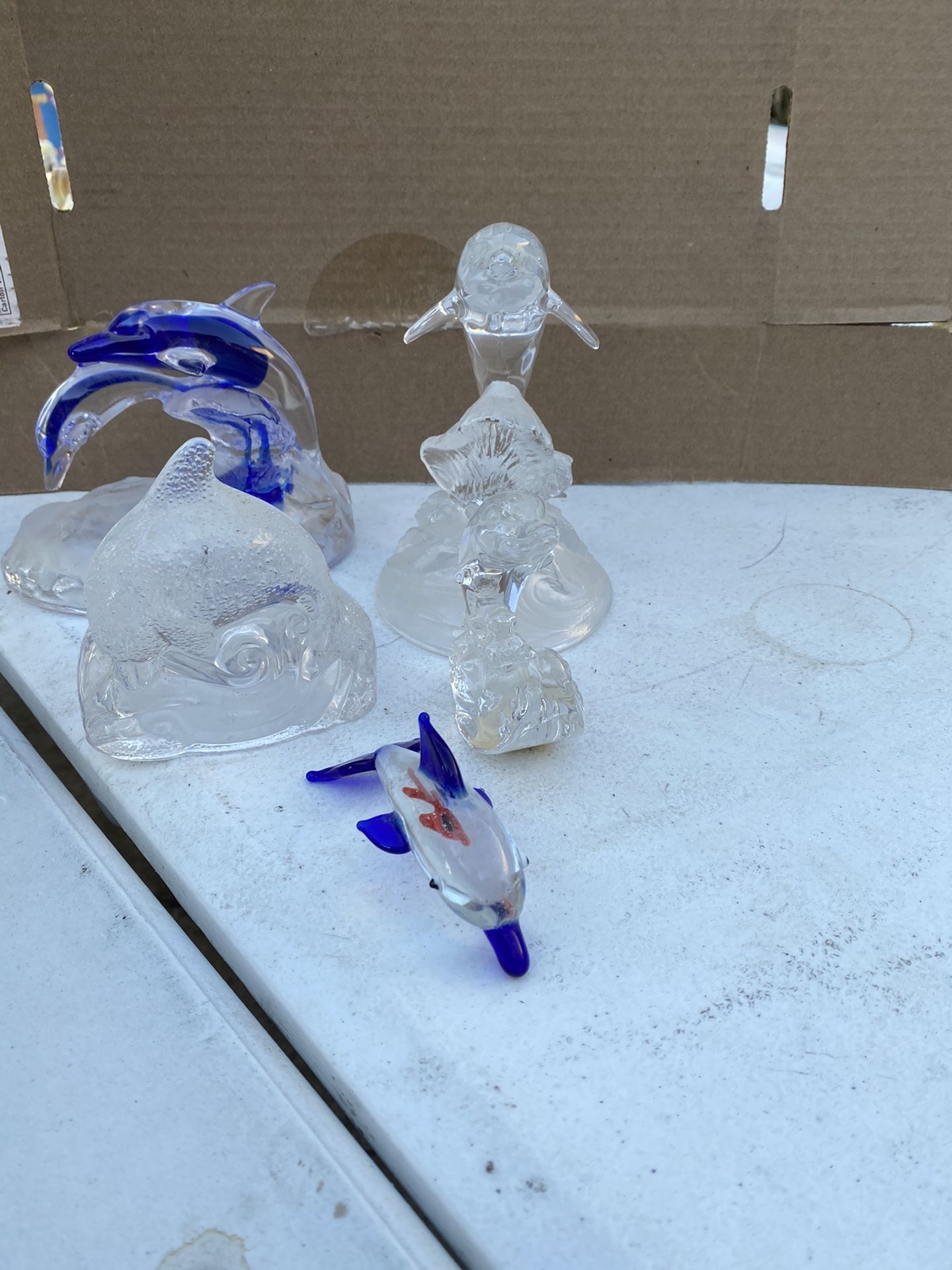 Five glass dolphins collectibles