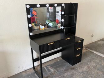 Black vanity with bench