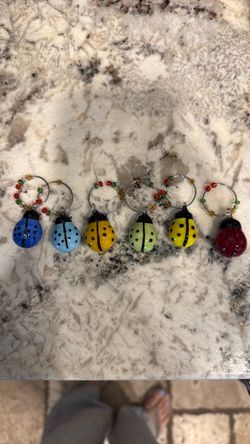 Ladybug, wine, glass, charms