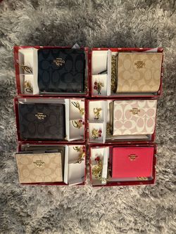 Coach mini wallet with 2 charms ($50) each one