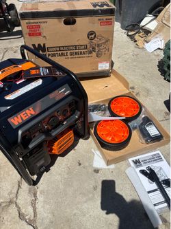Shop WEN 5,600-Watt Portable Gasoline Generator with Wheel Kit, Electric Start, 224cc, Transfer-Switch, RV-Ready, and CO Watchdog