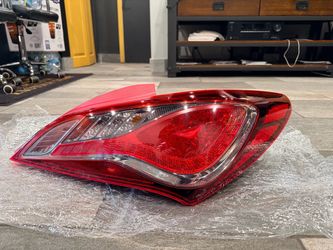 genuine OEM passenger-side (right, rear) outer tail light assembly and lens housing for 2013–2016 Hyundai Genesis Coupe