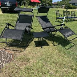 Two lounger chairs with table