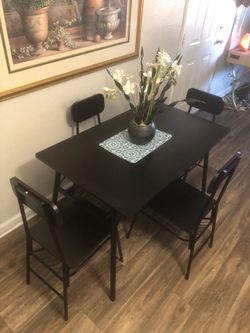 Like new black dining table set with 4 chairs