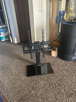 Black TV stand with adjustable mount. hardware included.