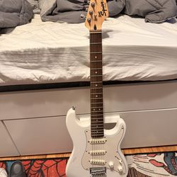 White fender electric guitar with case