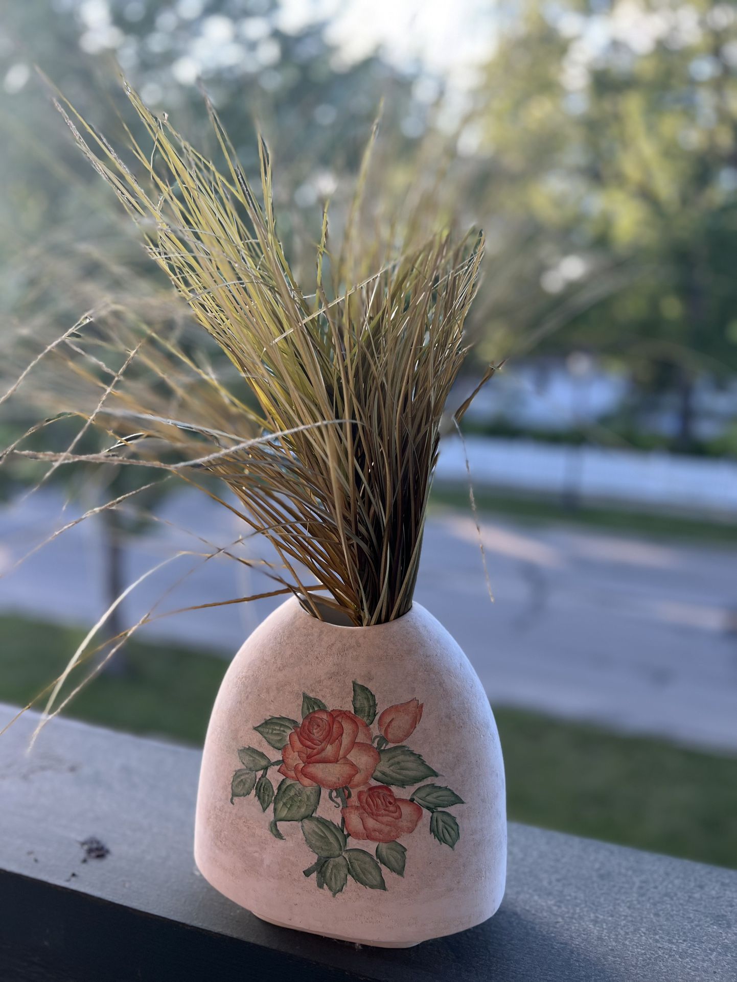 Vintage vase with fake grass
