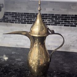 traditional brass Dallah, a classic Arabic coffee pot vintage