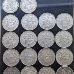 18 Morgan Silver Dollars