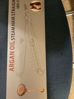 Flat Iron. Brand New. Curls, Straightens And Has Steam