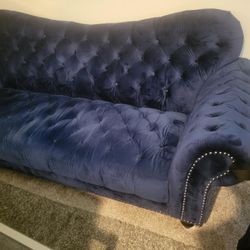 1 blue sofa and 2 yellow accent chairs