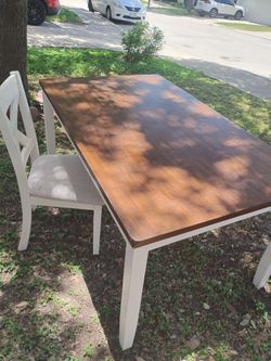 White table comes with 3 cushioned wooden chairs