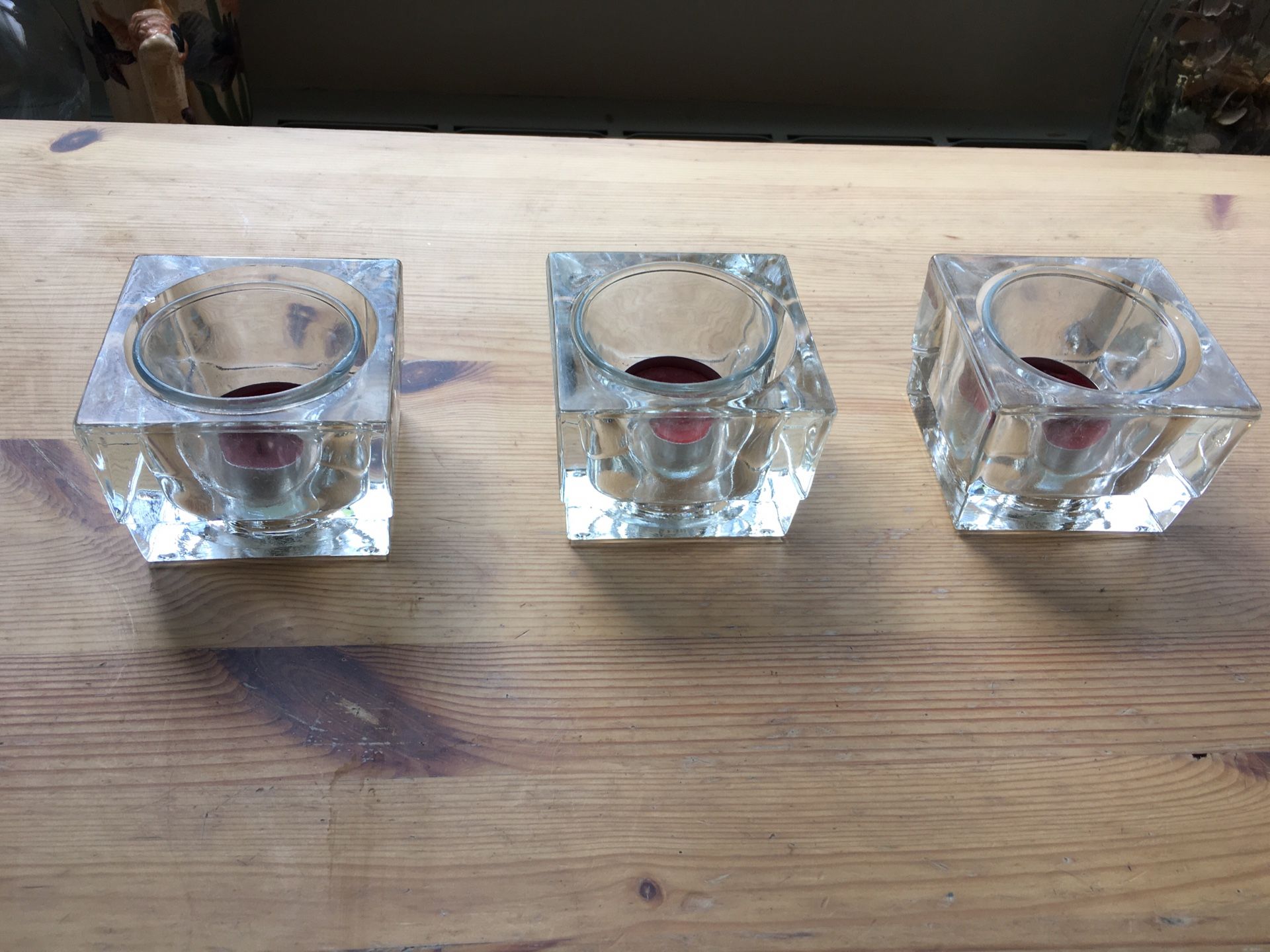 Set of three glass candle holders