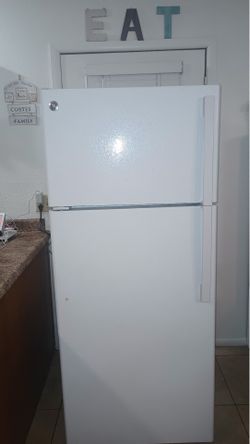 GE, White Refrigerator.  Wide 28”      Depth 29”     Tall 67”