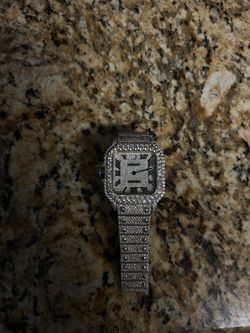 Iced out Cartier watch blue hand