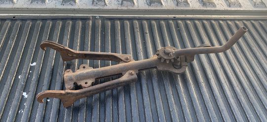 Model A split rim jack, a tool used in the 1920s to collapse or expand automobile rims.
