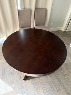 Round dining table with chairs