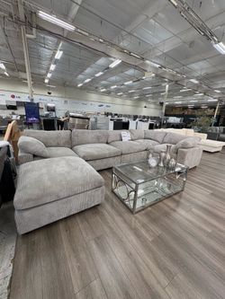 Large light gray corduroy 6pc modular sectional with ottoman
