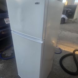 Summit Appliance CP962 two-door, 22-inch-wide refrigerator-freezer (slim width). It is like new and has seen little use; there is just a dent on the t