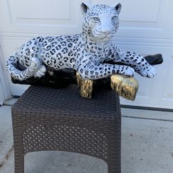 Snow Leopard On The Log Statue 