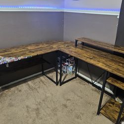 L-shaped desk with monitor stand and shelves