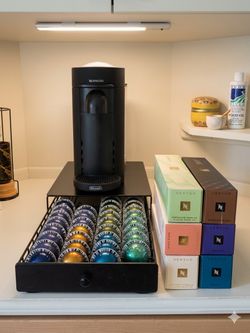 Nespresso machine, pods, and coffee pod organizer