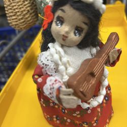 vintage collectible doll is a Lani Lei Princess Emele Hawaiian Tapa doll, handmade in Hawaii.  The doll has a hand-painted face, black yarn hair, and 