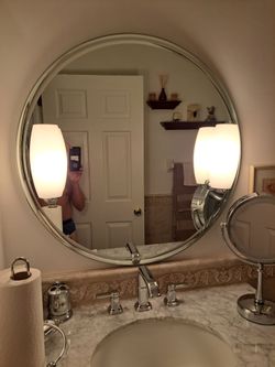 Mirror with light sconces