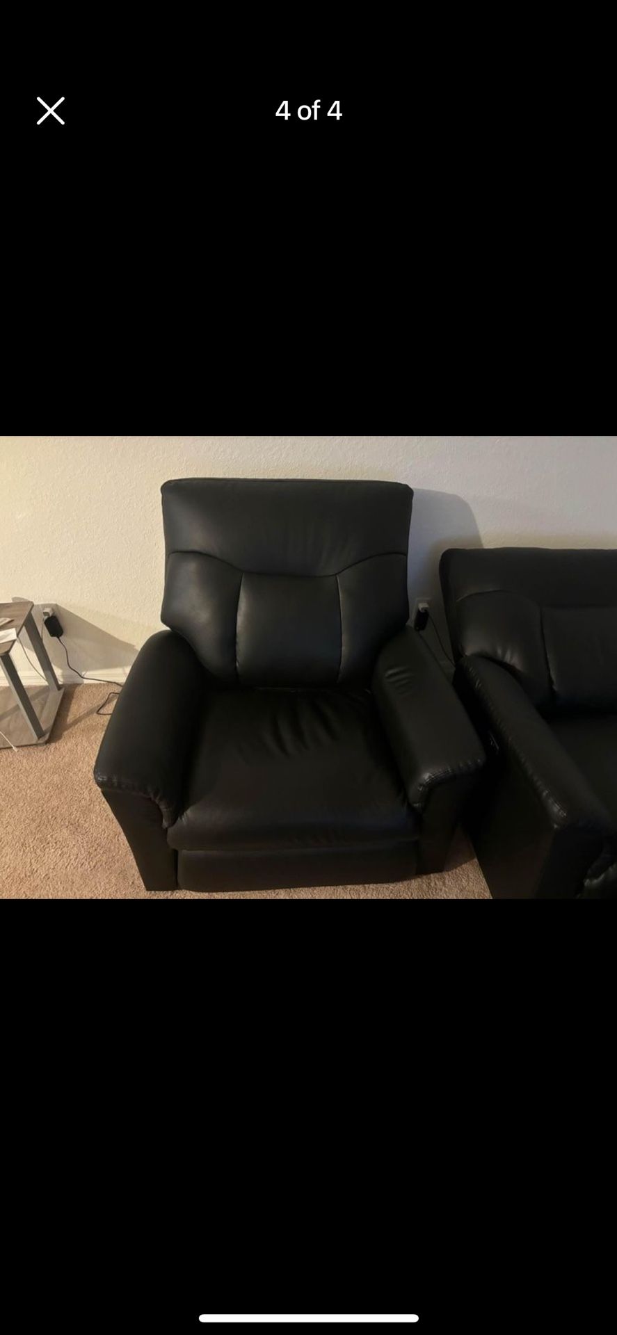 Two black leather recliners electric.