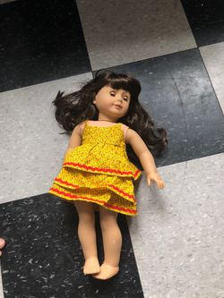 Toy doll and it’s clothes