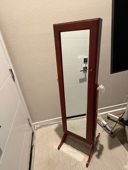 Jewelry cabinet with mirror and key