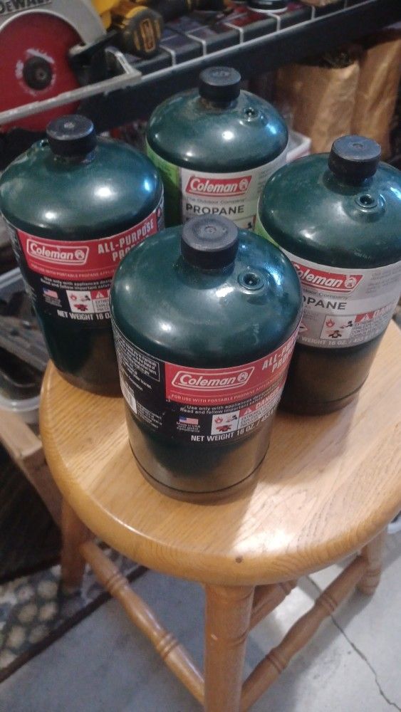 4 Full Coleman Propane Bottles. 12 All