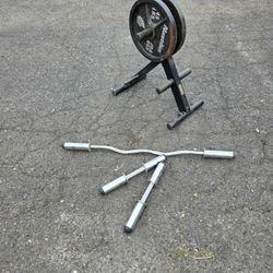 Free weight bars, storage rack and (2) 45lb weights