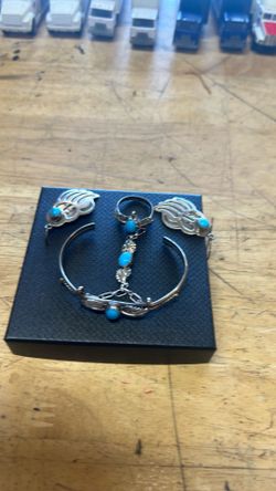 Sterling silver matching bracelet, ring, and earrings with turquoise settings