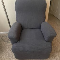 Reclining chair, with a cover due to scratches on the upholstery