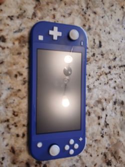 Nintendo Switch Lite with game.