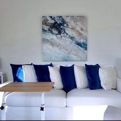 White Sofa With Blue Cushions 